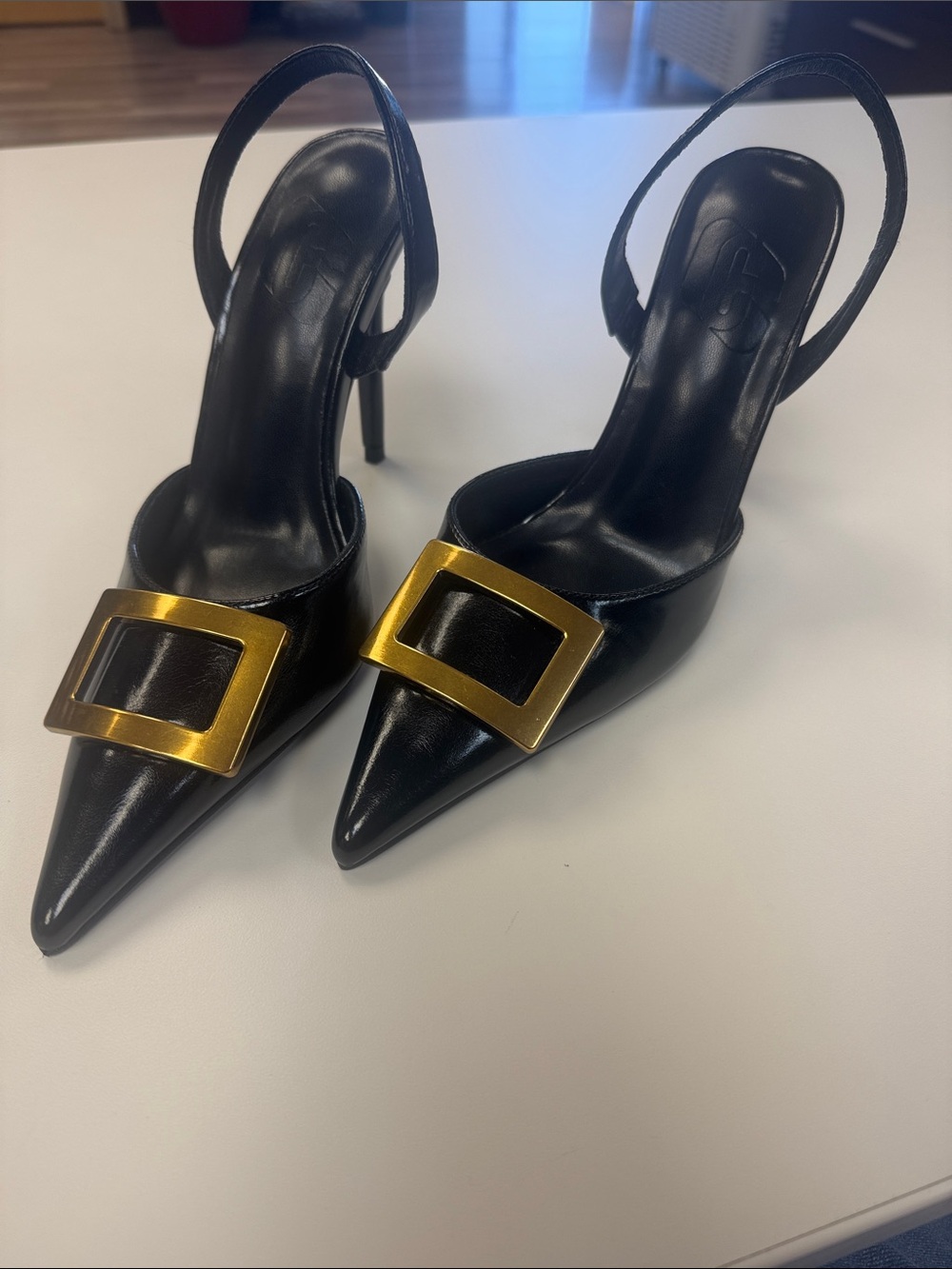 Unk Black Pointed-Toe Slingback Heels with Gold Buckle Accent